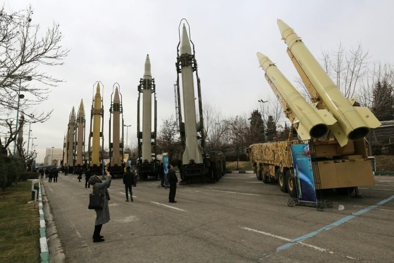 Iranians visiting a weaponry and military equipment exhibition