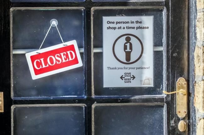 A 'Closed' sign on a shop door