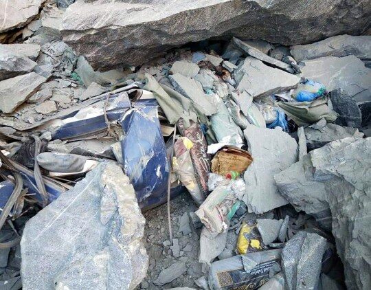 Click to enlarge The wreckage of a destroyed bus at a landslide
