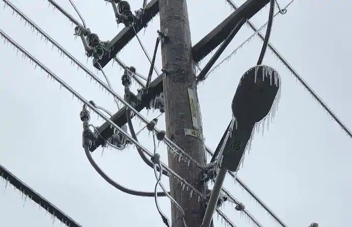 Click to enlarge Icicles hang from power lines and poles Tuesday in Oklahoma City