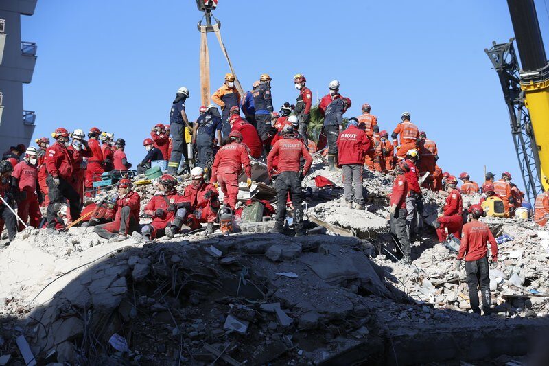 Click to enlarge Members of rescue services search in the debris of a collapsed building for survivors in Izmir, Turkey, early Sunday, Nov. 1, 2020.