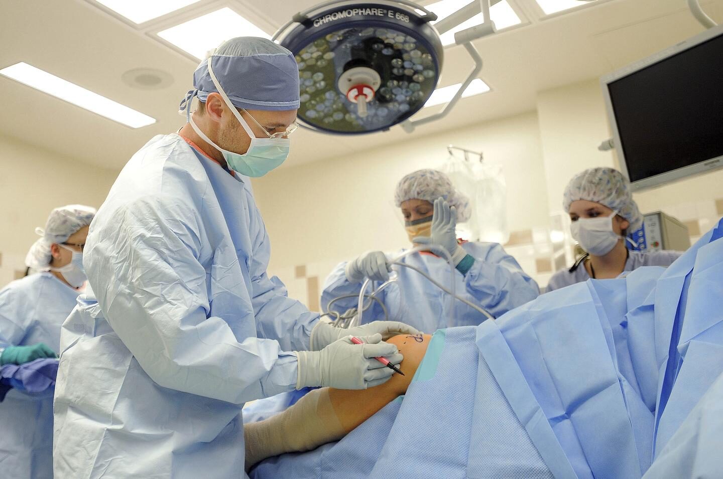 Click to enlarge Surgeons Performing Surgery