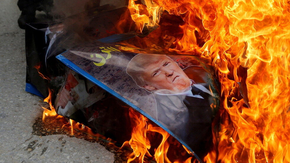 Click to enlarge burning Trump photo