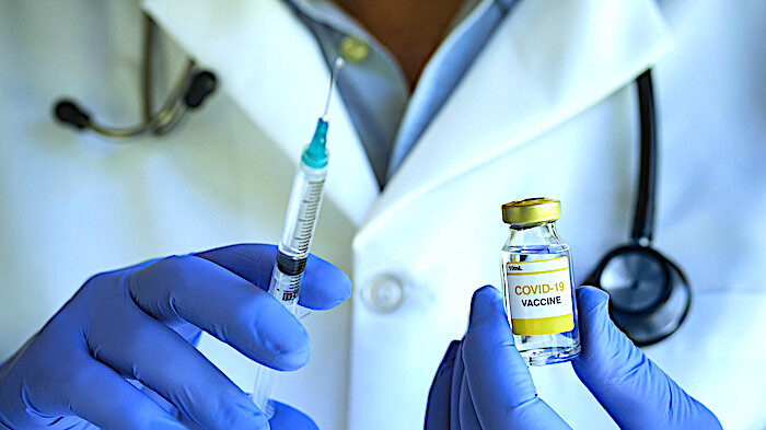 Click to enlarge vaccine and needle