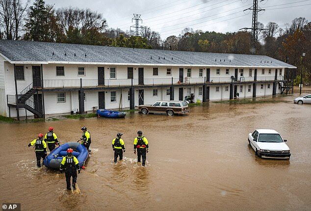 Firefighters with the Winston-Salem Fire Department arrive at Creekwood Apartments to assist with evacuations due to flooding on Thursday
