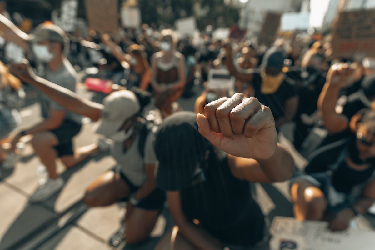 Click to enlarge protest kneeling fists raised