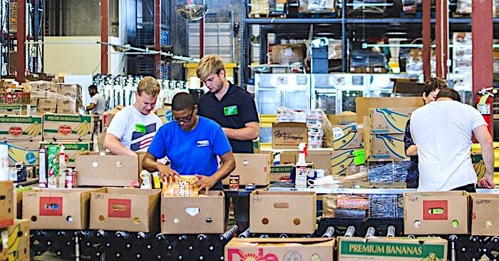 Click to enlarge Food bank workers