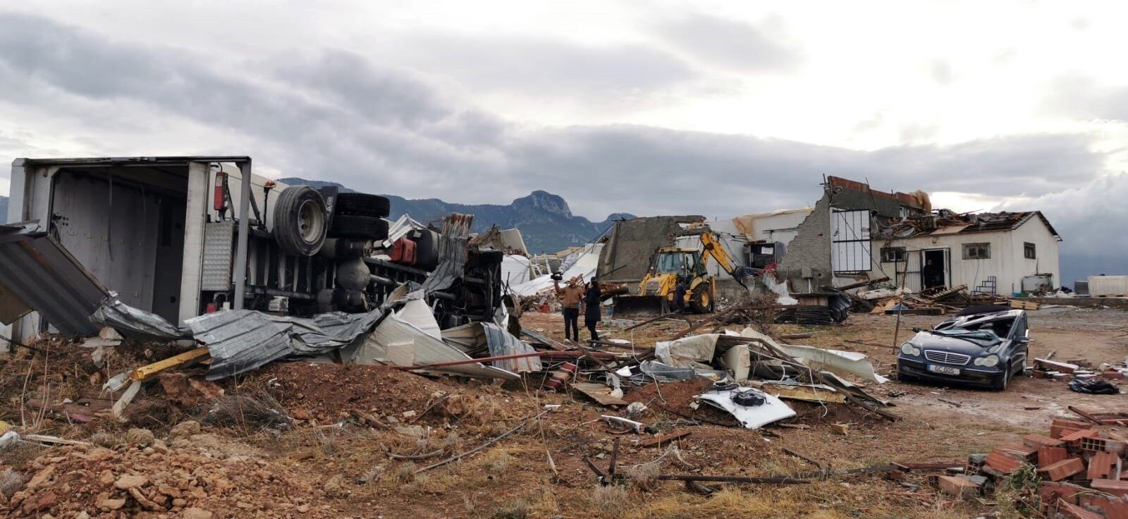 Damaged buildings and vehicles are seen in the aftermath of a tornado, in the Girne district, the Turkish Republic of Northern Cyprus (TRNC)