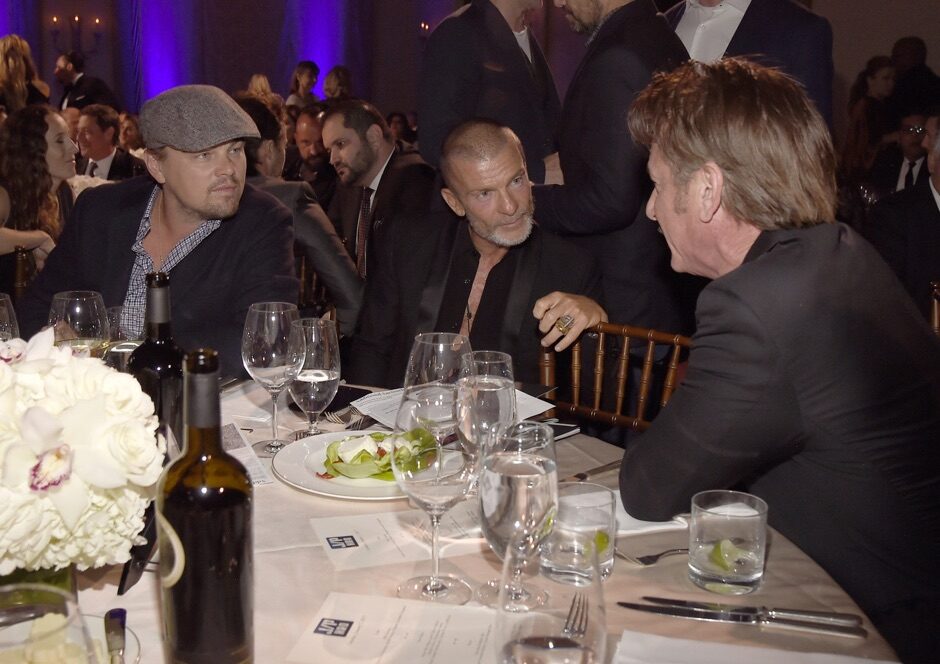 Click to enlarge Sean Penn with Vivi Nevo and Leonardo Di Caprio at the Haiti Rising Gala, 2017.