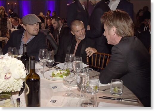 Click to enlarge Sean Penn with Vivi Nevo and Leonardo Di Caprio at the Haiti Rising Gala, 2017.