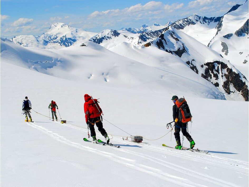 Click to enlarge Ben Pelto, Kindy Gosal, Alexandre Bevington and Jesse Milner take radar measurements while towing the radar high on the Nordic Glacier in the southern B.C. Interior.