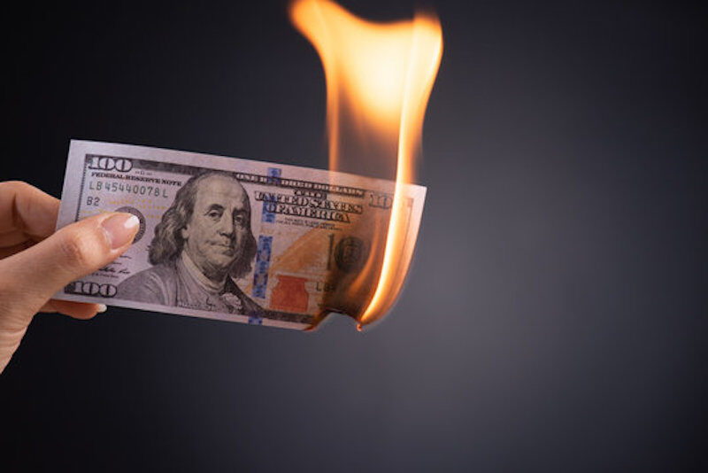 Click to enlarge burning money