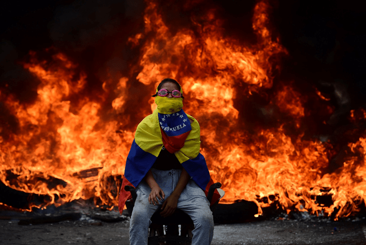protestor amid fire