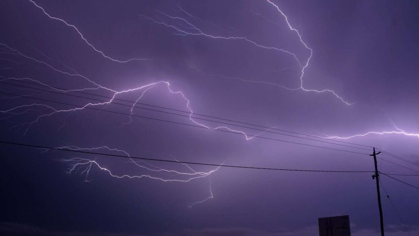 Incredible shades of purple were captured in the lightning storm around Mackay.