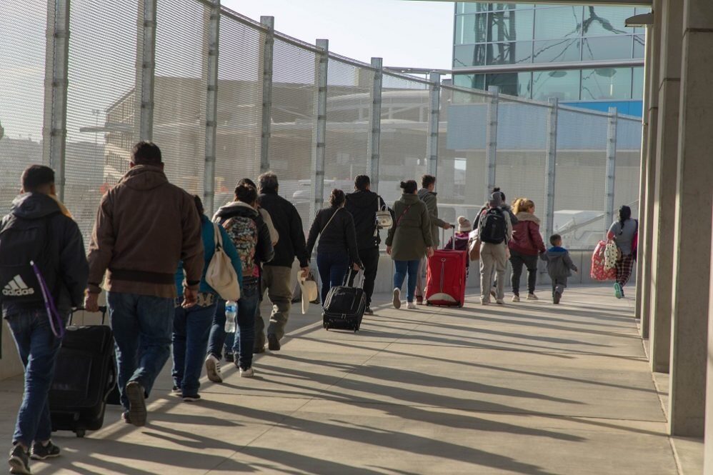 passengers arrive airport immigrants