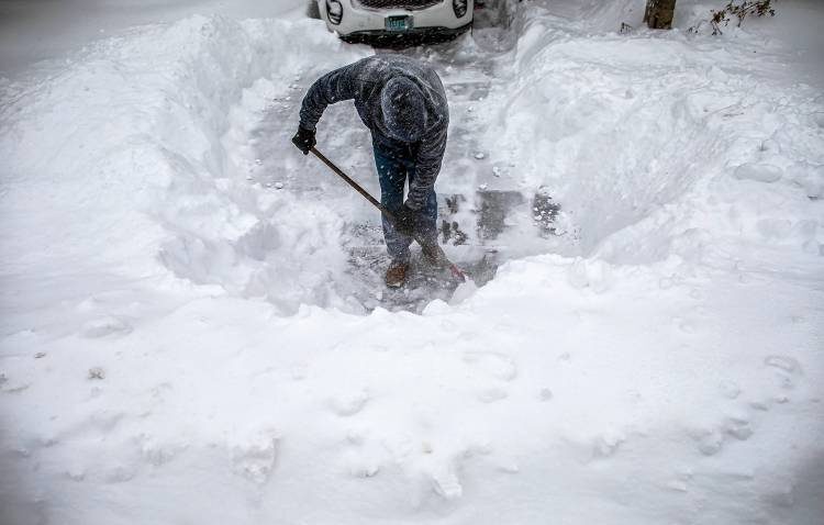 Click to enlarge man shovel snow