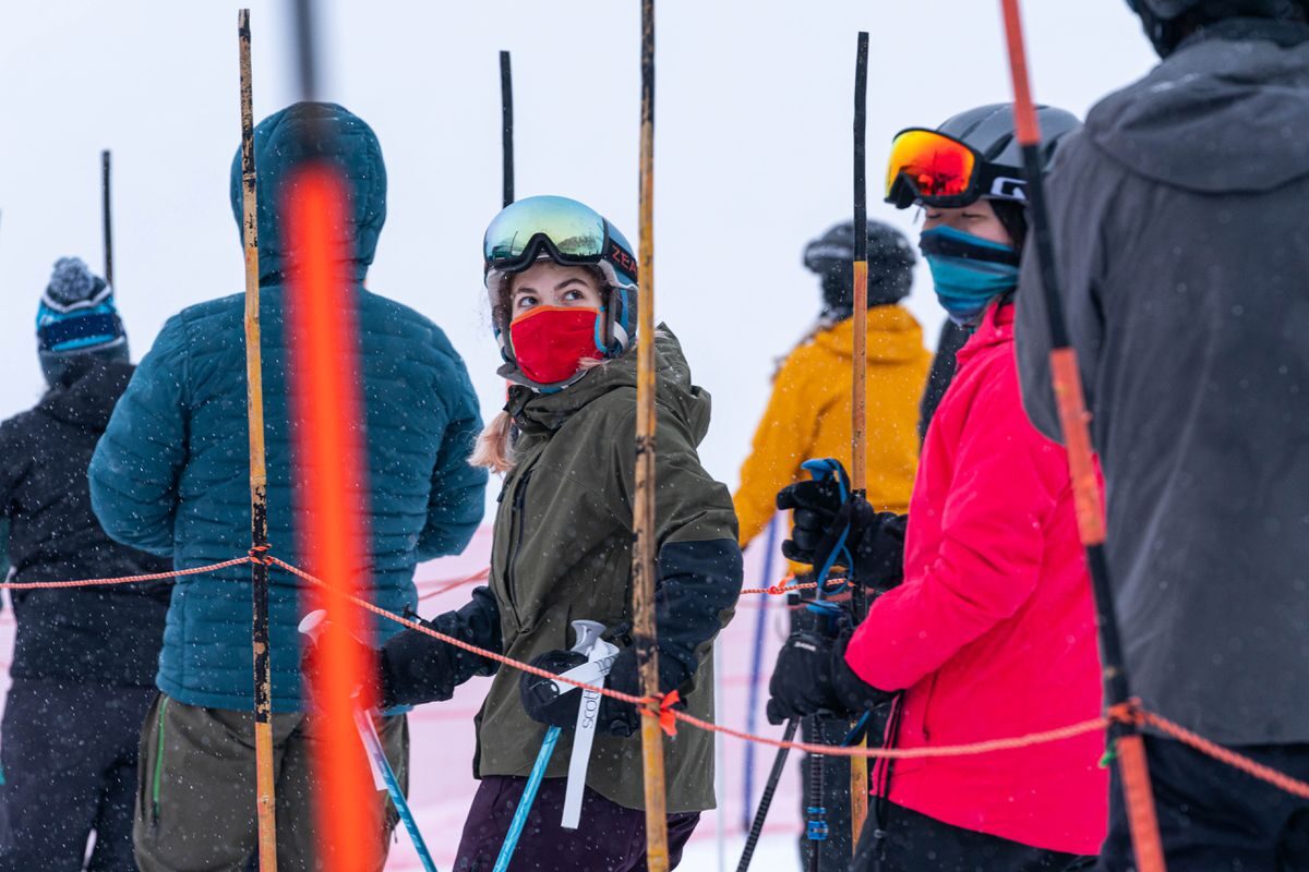 Skiers wear masks while waiting in a lift line at Alyeska Resort on opening day, Friday, Dec. 18, 2020 in Girdwood.