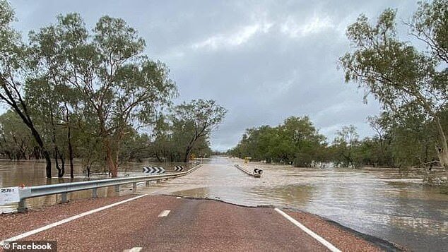 Click to enlarge 'We did have some exceptional rainfall and storms in the evening,' meteorologist James Thompson said (Pictured: road closed in Queensland from flooding)