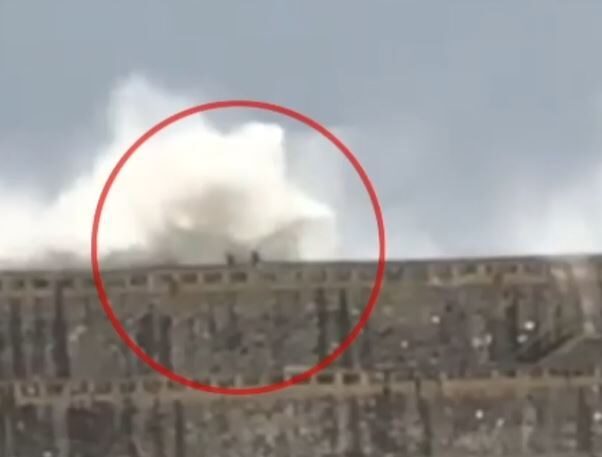 Click to enlarge The moment the 28-year-old was swept off the pier by a huge wave