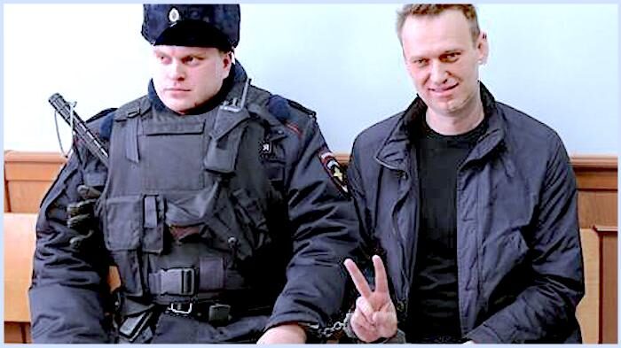Click to enlarge Navalny and officer