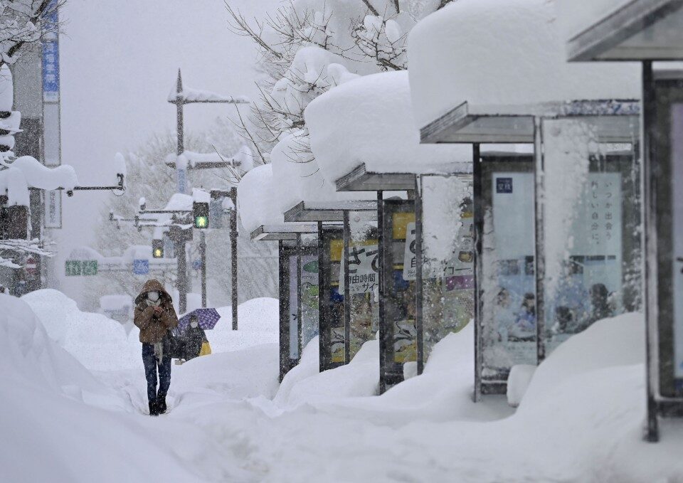 Click to enlarge Photo taken on Jan. 9, 2021, shows a snow-covered street in Toyama, central Japan, after heavy snow hit the region.