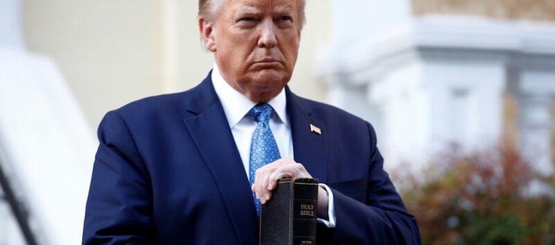 Click to enlarge Trump with bible