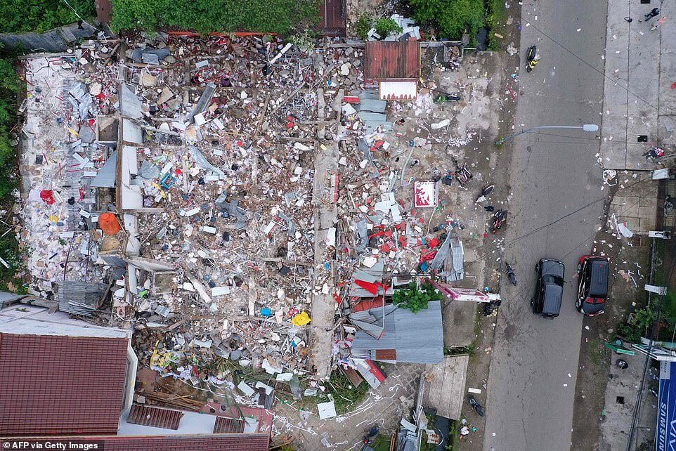 An aerial picture shows flattened homes in Mamuju, West Sulawesi