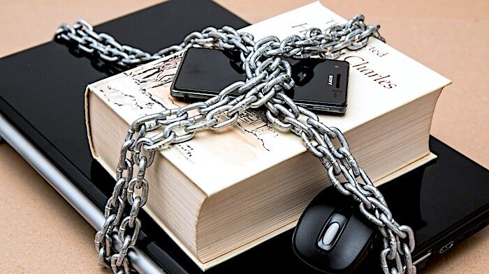 Click to enlarge book-laptop-phone chained
