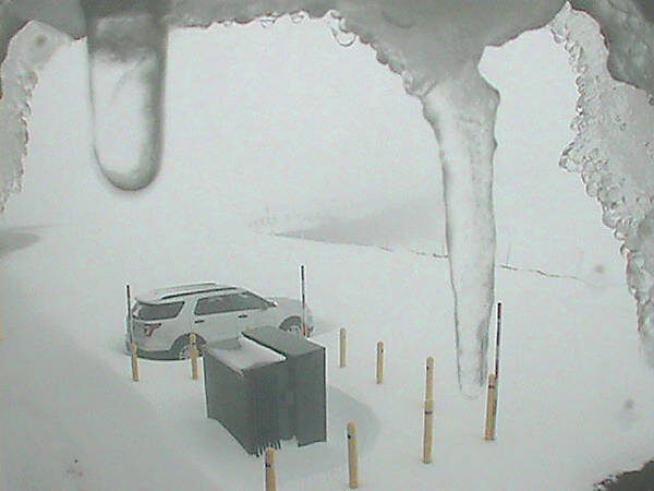 The Maunakea summit was blanketed with snow Monday evening amid a winter storm warning that remains posted for Hawaii Island summits until 6 p.m. Tuesday.