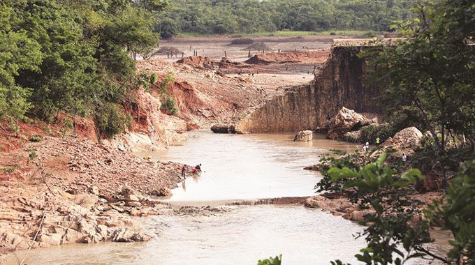 Remains of the Iron Duke Mine Dam wall after the dam burst yesterday morning in Mazowe.