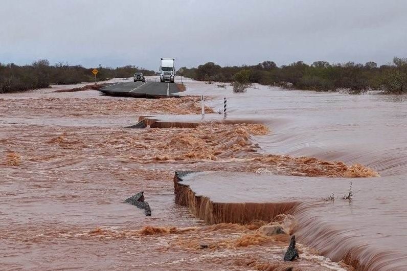 Motorists and truckies are trapped on islands between floodwaters.