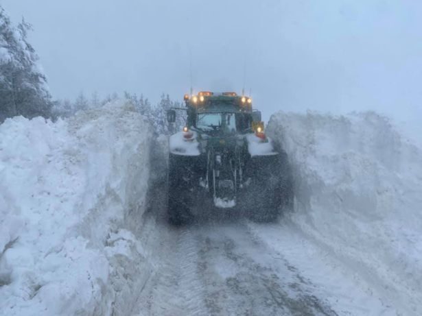 Farmers plough over six foot of snow in Aberdeen