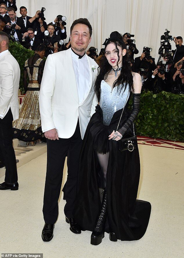 Click to enlarge Elon Musk pictured with artist Grimes