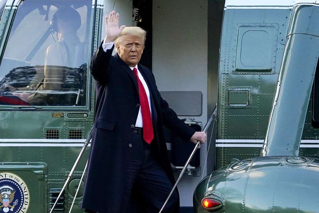 trump waves boards marine one