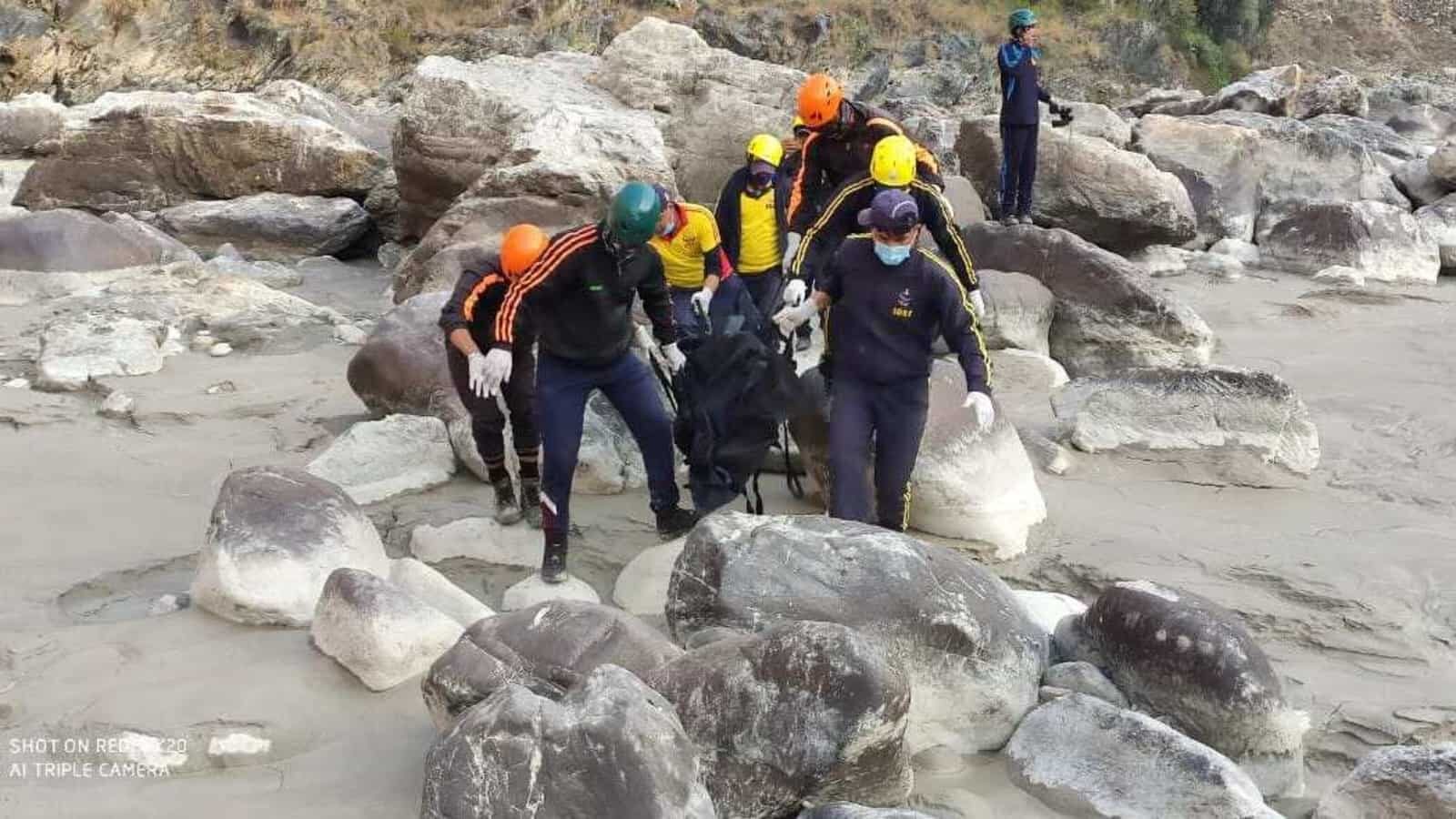 SDRF men retrieving a body from Alaknanda river on Wednesday.