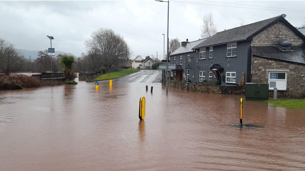 The River Usk has burst its banks, affecting roads in Crickhowell and nearby Llangattock in Powys