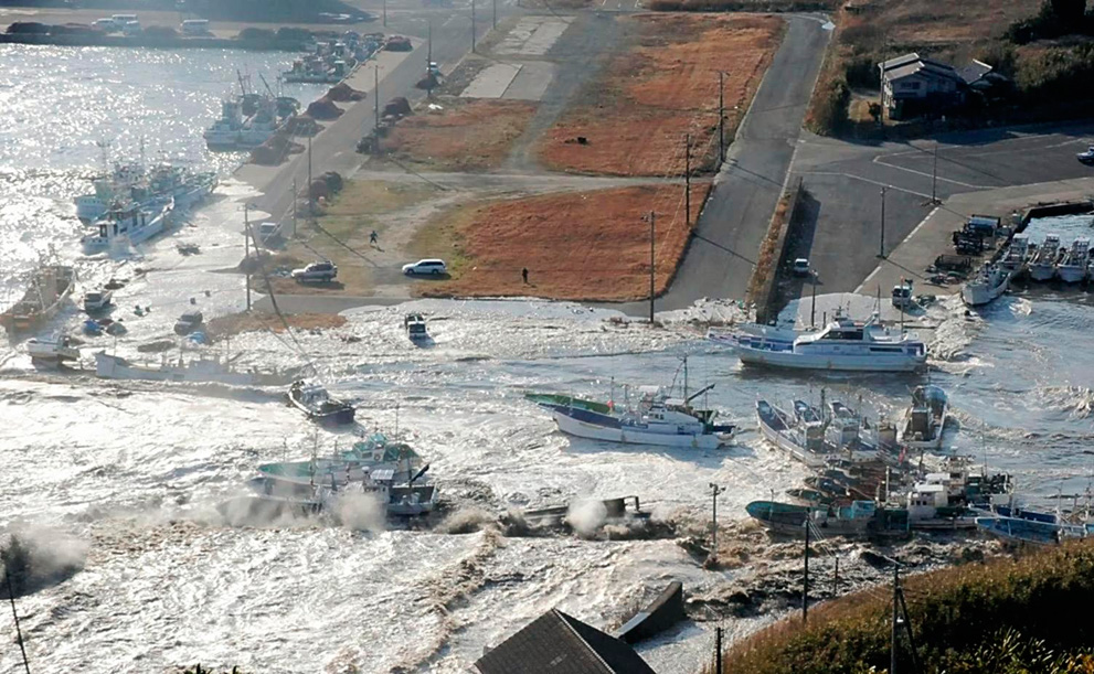 Boats are swept by a wave