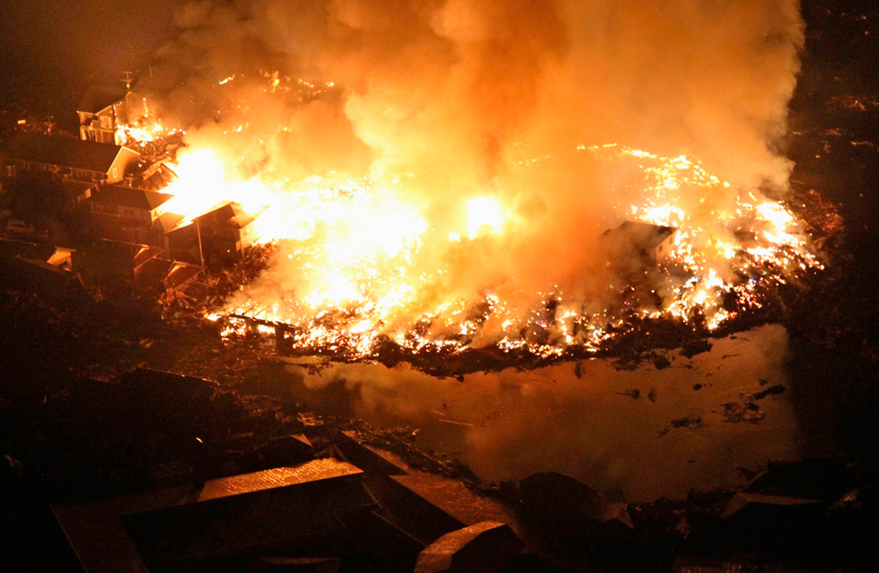 Houses burn at night