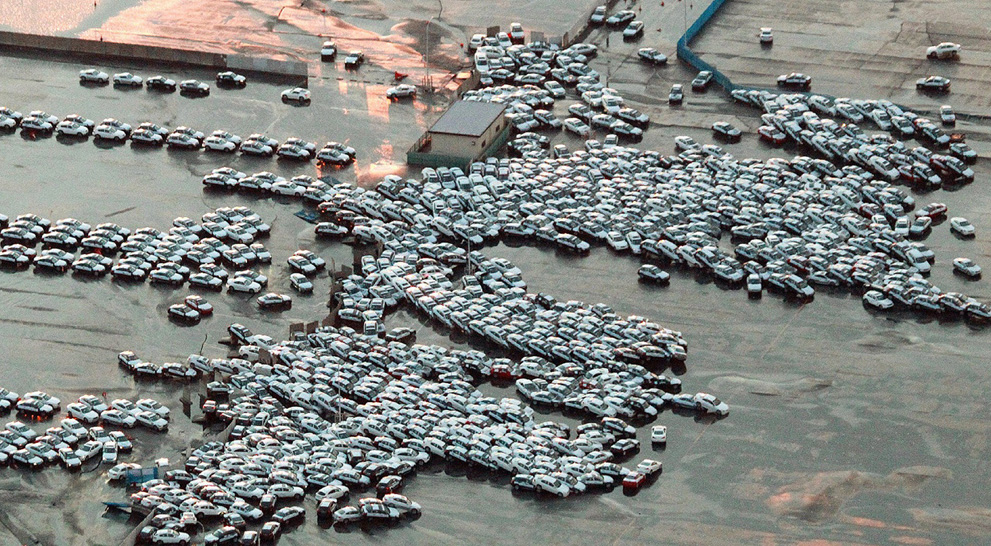 An aerial shot shows vehicles