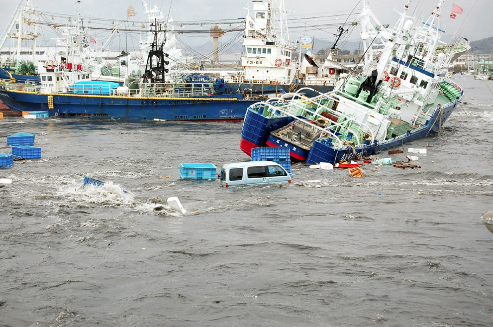 Fishing boats and vehicles are carried