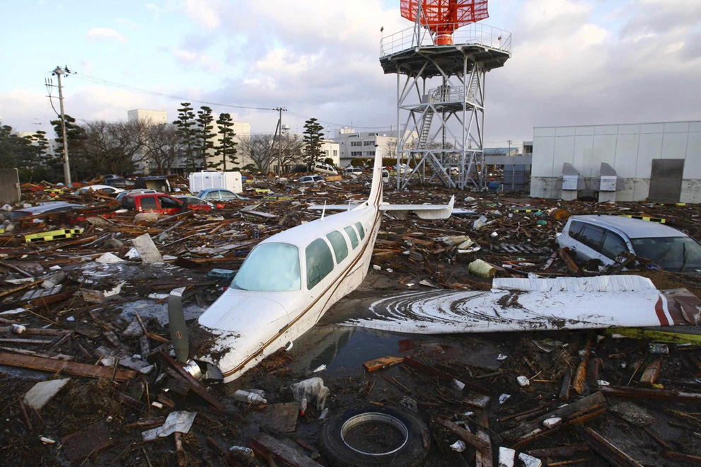 A light aircraft and vehicles swept