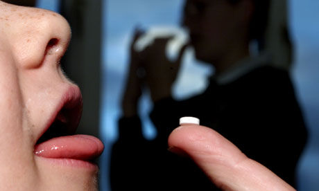 Child taking a pill