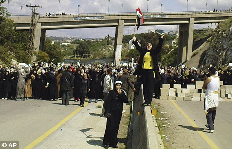 Click to enlarge women block highway