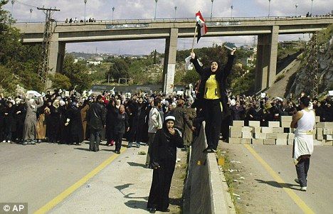 Click to enlarge women block highway