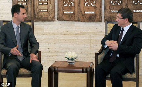 Click to enlarge Assad and Devutoglu