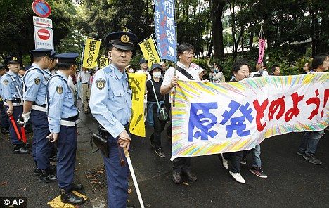 Click to enlarge March: Police officers monitor the protest