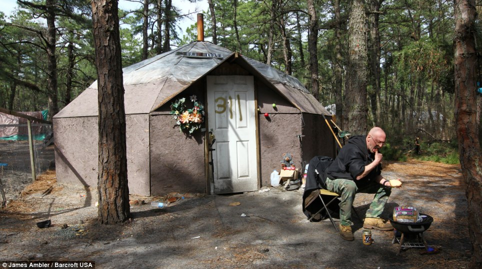  Destitute: Charlie Errickson, 54, sat eating his lunch outside his shelter as he struggles to survive