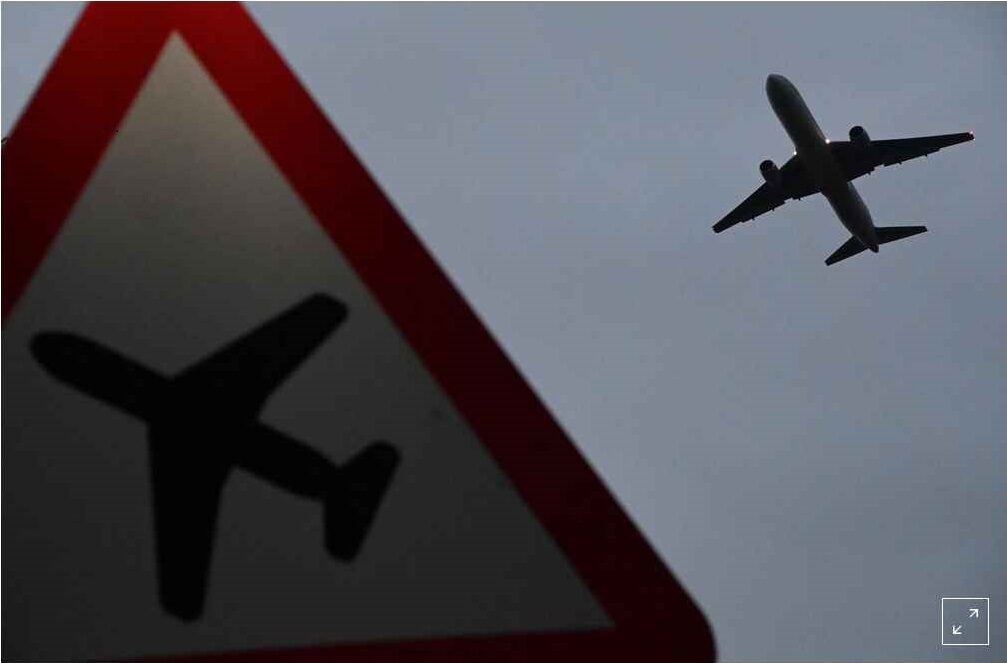 Click to enlarge plane flying overhead
