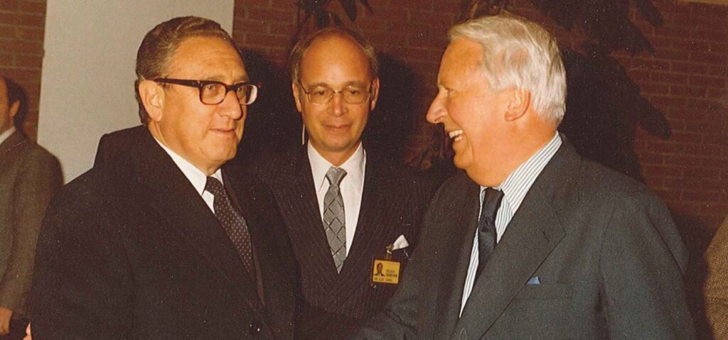 Henry Kissinger and his former pupil, Klaus Schwab, welcome former- UK PM Ted Heath at the 1980 WEF annual meeting.