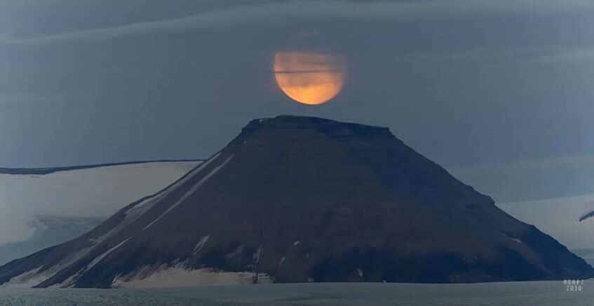 Volcano under moon